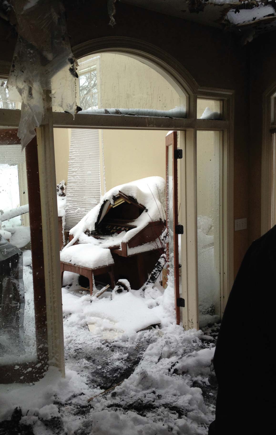 Interior of a fire damaged home with extinguisher foam everywhere.
